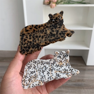 Leopard shaped acetate hair claws in amber and white cheetah print for women