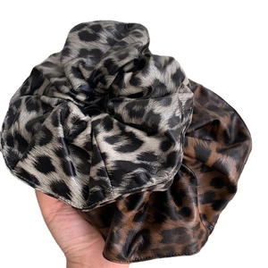 Set of two leopard print PU leather scrunchies in brown and grey animal patterns