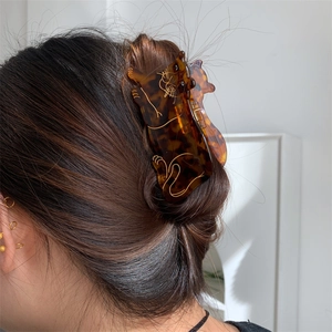 Acetate cat shaped hair claw clip in tortoiseshell leopard pattern on blonde hair