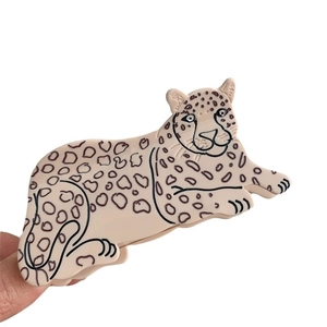 Minimalist acetate hair claw clip in leopard animal shape with leopard print pattern