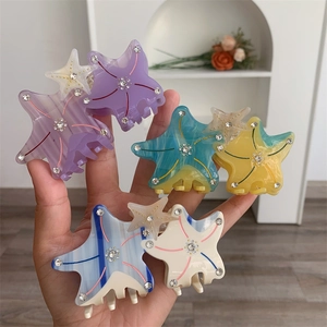 Starfish shaped acetate hair claw clips with rhinestones in various candy colors