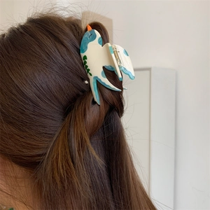 Pince à cheveux élégante en forme d'hirondelle en acétate avec des détails peints à la main