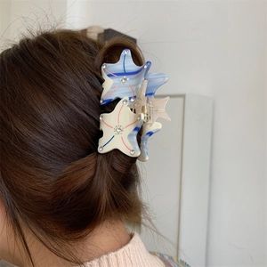 Elegant starfish acetate hair claw clip with rhinestones and colorful wave patterns