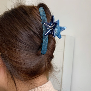 Pinza per capelli a forma di stella marina in acetato blu con effetto marmorizzato