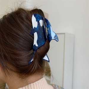 Orca shaped acetate hair claw clip with blue marble texture for long hair styling