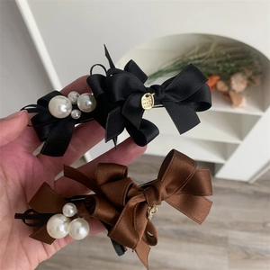 Elegant bow hair clips with pearls in black and brown satin with metal charms