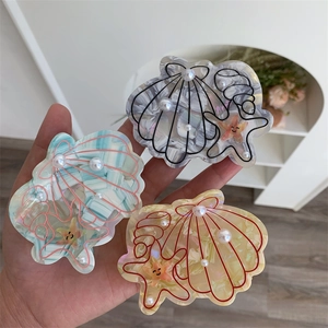 Acetate hair claw clip set in sea shell and starfish shapes with pearl accents