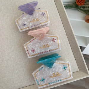 Elegant acetate perfume bottle shaped hair claw clips with colorful crystals and marble texture