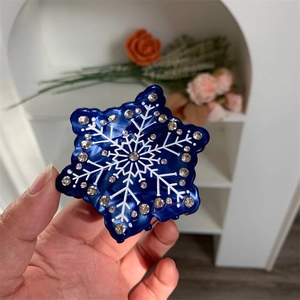Pince à cheveux flocon de neige bleu foncé avec strass brillants et finition acétate