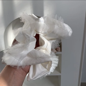Detailed view of the oversized scrunchie with ivory satin and delicate lace trim edges