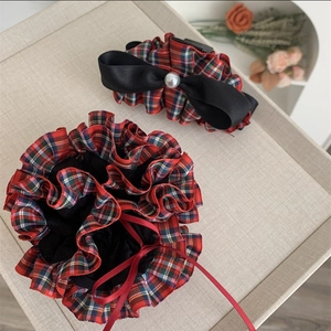 Elegant red plaid hair scrunchie and bow shark clip set with pearl accent for holidays