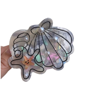 Ocean series acetate scallop shell hair claw with faux pearls and starfish design