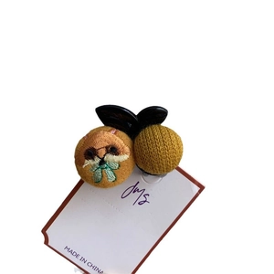 Embroidered cartoon hair claw featuring ginger animal embroidery and yellow knit sphere