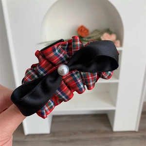 Elegant red plaid hair claw clip with black satin bow and pearl detail for women