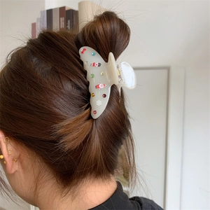Pinza per capelli natalizia in acetato con strass colorati e motivi di Babbo Natale