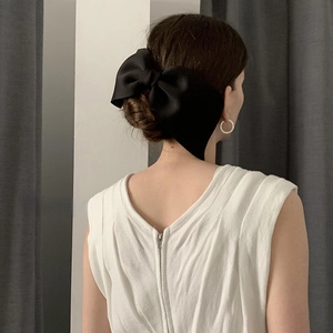 Elegant large black satin bow hair clip for women with classic French style hair accessory