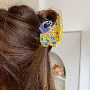 Peacock shape hair claw clip with yellow and blue-purple gradient shell texture