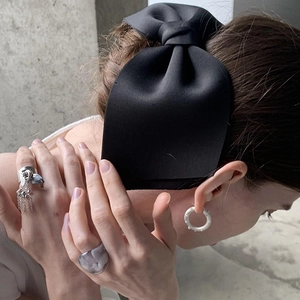 Elegant large black satin bow hair clip styled with vintage silver and resin jewelry