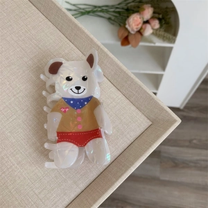 Detail of cute bear hair claw clip with pearlescent texture and colorful cartoon patterns