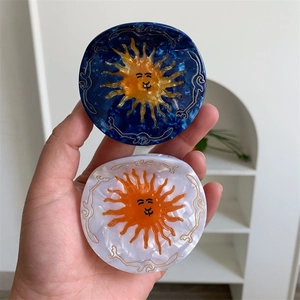 Cellulose acetate sun shaped hair claw clips with marble texture for elegant women