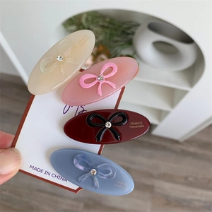 Set of 4 acetate bow hair clips in cream pink burgundy and blue with rhinestones