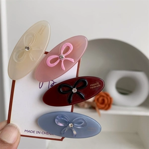 Set of four acetic acid bow hair clips in cream, pink, burgundy and grey-blue colors