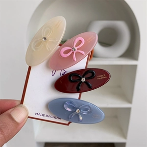 Set of 4 cute acetate bow hair clips in cream, pink, burgundy and blue for women