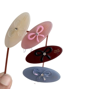 Set of four colorful acetate bow hair clips for women with elegant resin finish