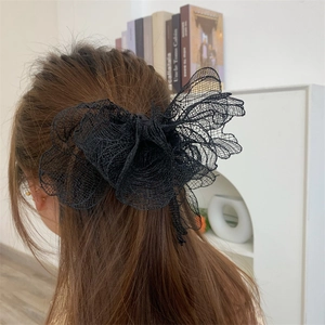 Elegant large black layered mesh lace flower hair scrunchie shown in back hairstyle