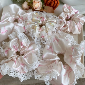 Elegant satin hair scrunchies with pink bow pattern and delicate lace trim set