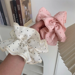 Pink and cream satin oversized polka dot scrunchies with elegant ruffled design