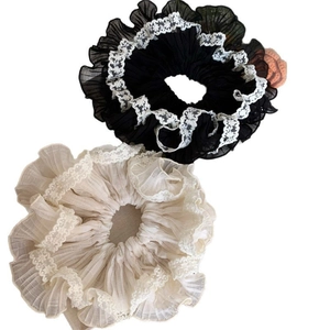 Black and cream oversized lace-trimmed chiffon scrunchies for elegant hair styling