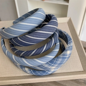 Blue plaid and striped fabric headbands in various patterns for women and girls
