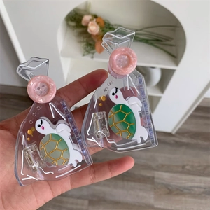 Detail shot of transparent turtle hair clips with cute cartoon design and metal spring