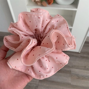 Elegant large pink polka dot satin scrunchie with glossy finish for women hair styling