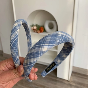 Close-up of blue and white checkered fabric headbands with non-slip inner lining