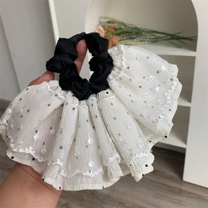 Elegant white lace polka dot scrunchie with black ruffled center for women hair styling