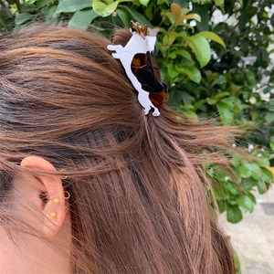 Detail of Corgi dog shaped acetate hair claw clip showing dual-tone tortoiseshell pattern