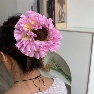 Pink and beige layered ruffle scrunchie for elegant bun or ponytail hairstyles