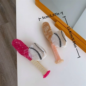 Detail view of acetate baseball bat hair claw clip showing precise size and marble texture