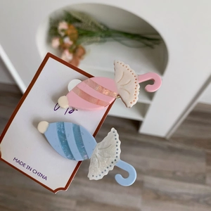 Kreative Haarklammern in Süßigkeitenform aus Acetat in Rosa und Blau mit Glitzer
