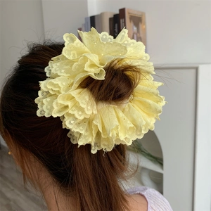 Elegant pale yellow layered lace scrunchie with floral crochet details for women hair
