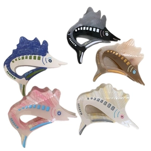 Fish shaped acetate hair claw clips in five ocean marble textures and colors