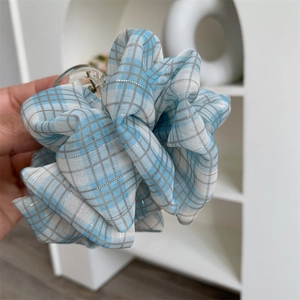 Blue plaid fabric hair claw clip with silver metallic threads in a French retro style