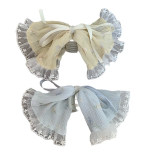 Elegant lace bow hair claw clip with pearls in beige and blue for summer vacation style