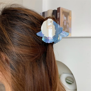 Sky blue and white sunfish acetate hair claw clip for a cute half-up hairstyle