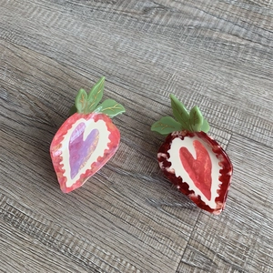 Sweet strawberry hair claw clips in pink and red acetate with heart pattern