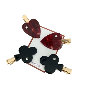 Creative poker heart and clover acetate hair clips with crystal inlay on a display card