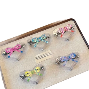 Five-piece set of colorful heart-shaped acrylic hair clips with candy stripe bows