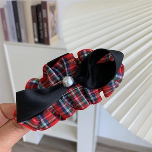 Vintage red plaid hair claw clip with bow and pearl detail for elegant hairstyles